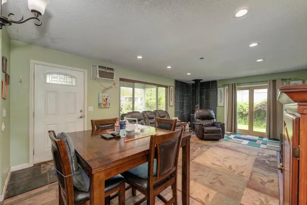 a view of a dining room with furniture window and outside view