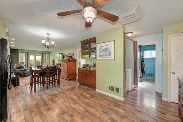 a view of a dining room with furniture window and wooden floor
