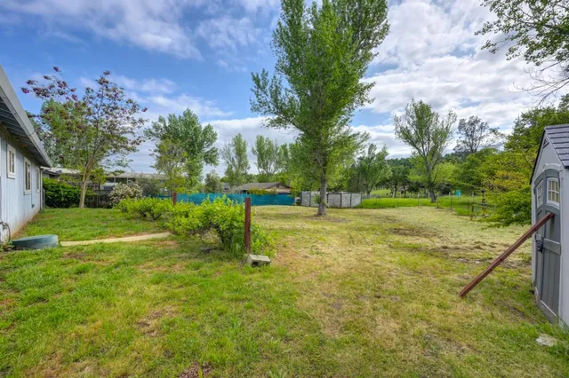 a view of a playground with basketball court