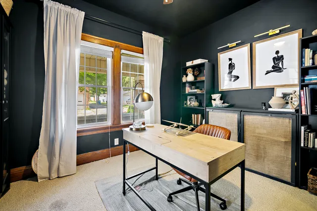 a view of a dining room with furniture and window