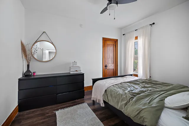 a bedroom with a bed and a dresser