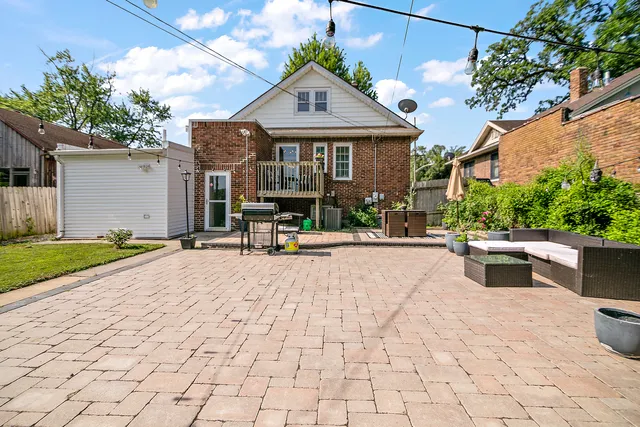 a view of a house with sitting area and a yard