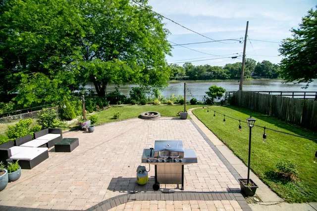 a view of a swimming pool and lounge chair