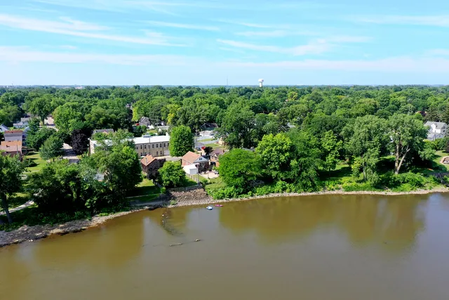 a view of a garden with a lake view