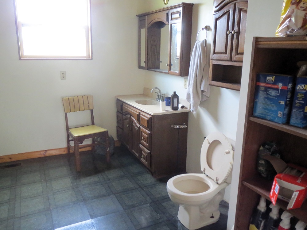 21785 Brooks Road Prophetstown, IL 61277 - Photo 20 of 38 a bathroom with a toilet sink and mirror