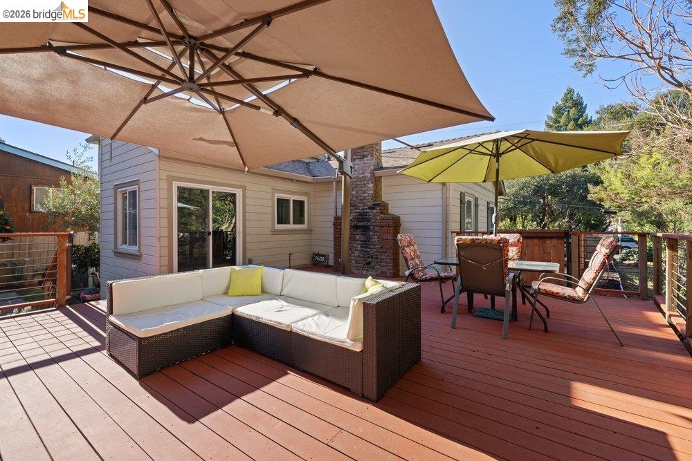 9600 Golf Links Road Oakland, CA 94605 - Photo 2 of 47 Wooden deck with outdoor dining space and outdoor lounge area