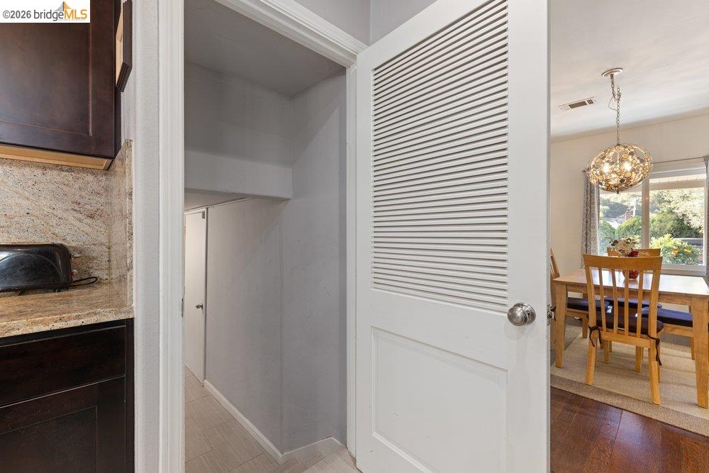 9600 Golf Links Road Oakland, CA 94605 - Photo 26 of 47 Detailed view of a chandelier and wood finished floors