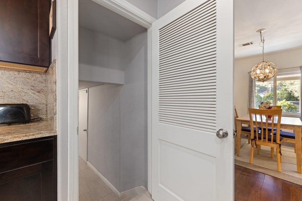 9600 Golf Links Road Oakland, CA 94605 - Photo 26 of 47 Detailed view of a chandelier and wood finished floors