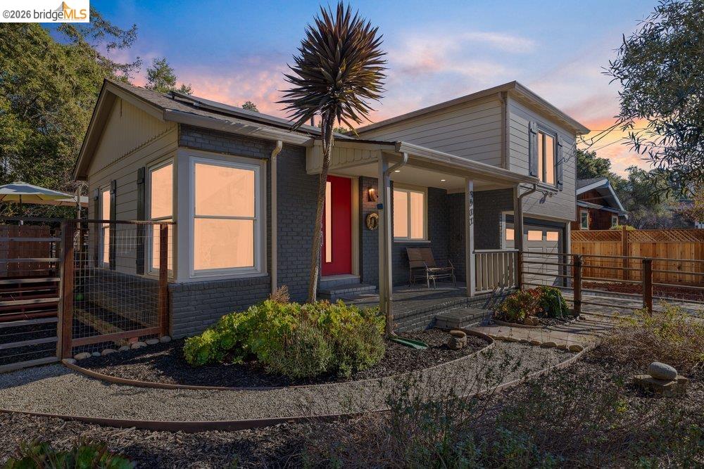 9600 Golf Links Road Oakland, CA 94605 - Photo 47 of 47 View of front of house with brick siding, covered porch, and a garage