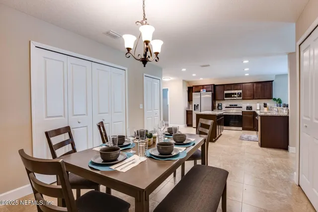 a view of a dining room with furniture