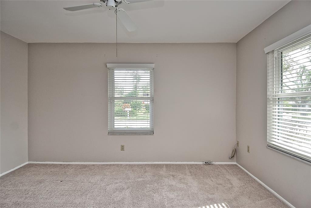 4058 Center Pointe Place, Unit 28A Sarasota, FL 34233 - Photo 15 of 24 an empty room with a window