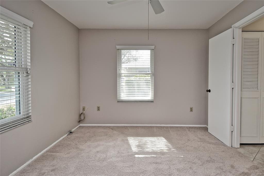 4058 Center Pointe Place, Unit 28A Sarasota, FL 34233 - Photo 17 of 24 a view of an empty room with a window