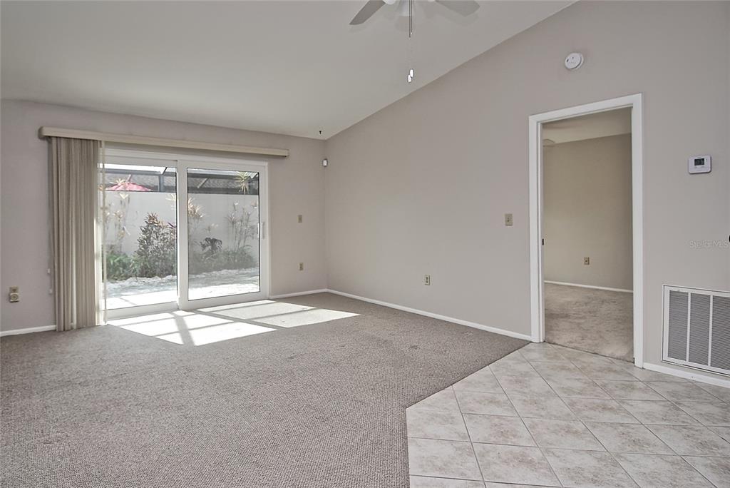 4058 Center Pointe Place, Unit 28A Sarasota, FL 34233 - Photo 2 of 24 a view of empty room with floor to ceiling window