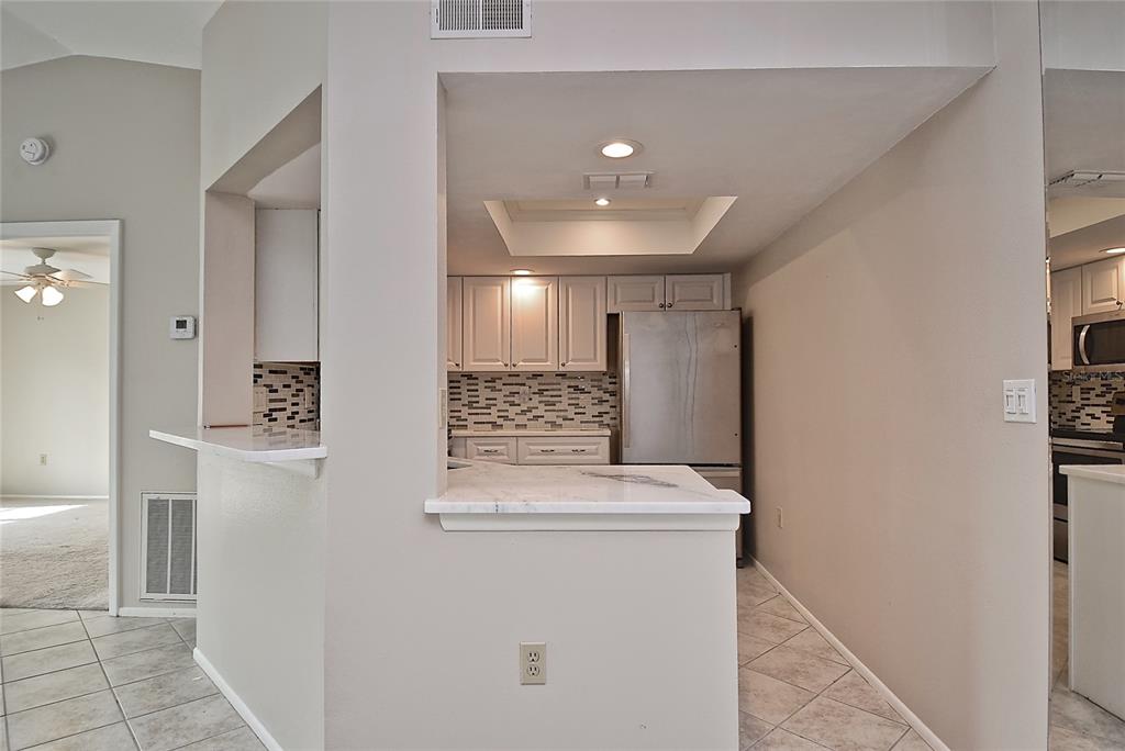4058 Center Pointe Place, Unit 28A Sarasota, FL 34233 - Photo 5 of 24 a view of a hallway with washer and dryer