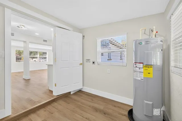 a view of an entryway with wooden floor