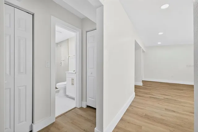 a view of a bathroom from the hallway