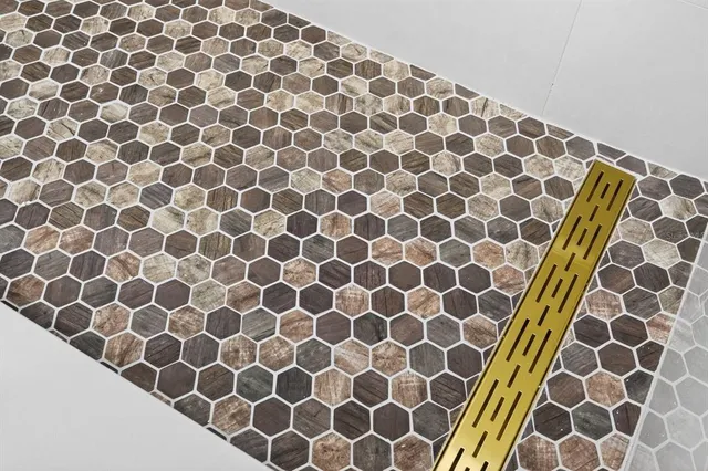 a bathroom with a black and white shower curtain