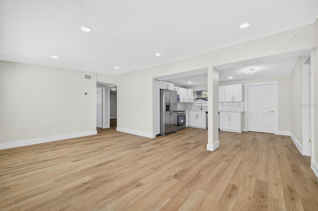 928 Valmar Street Brandon, FL 33511 - Photo 5 of 35 a view of an empty room with wooden floor