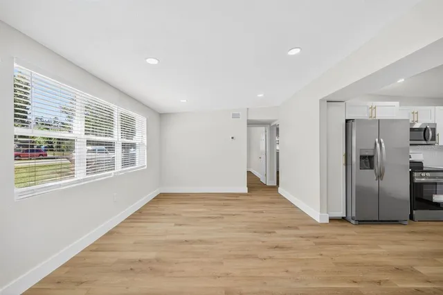 a view of an empty room with a window