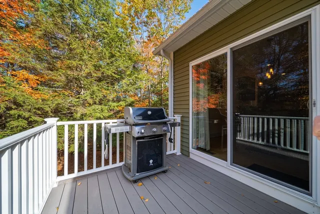 a view of a deck with wooden floor and fence