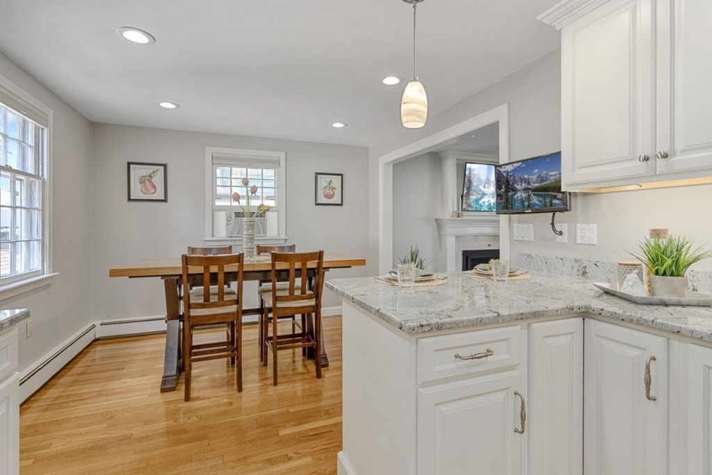 25 Oak Street Reading, MA 01867 - Photo 18 of 42 a kitchen with a table and chairs in it