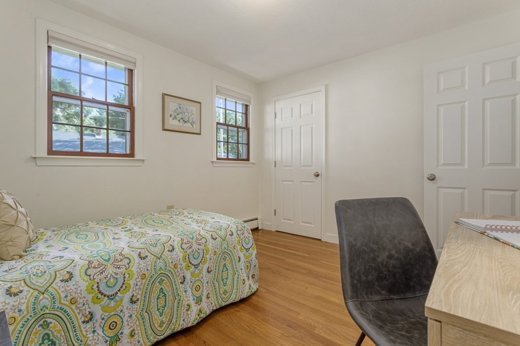 25 Oak Street Reading, MA 01867 - Photo 23 of 42 a bedroom with a bed and a window