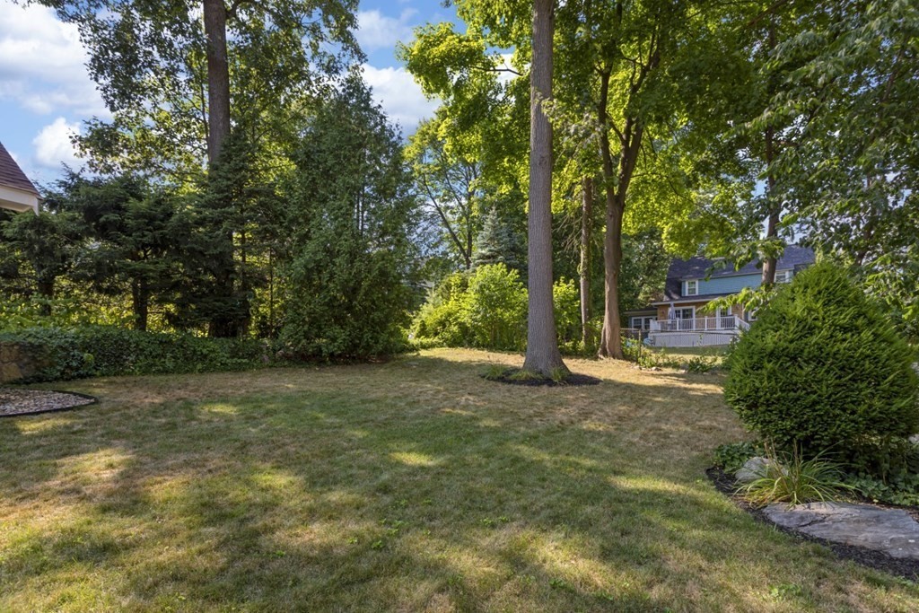 25 Oak Street Reading, MA 01867 - Photo 39 of 42 a view of a yard with plants and large trees