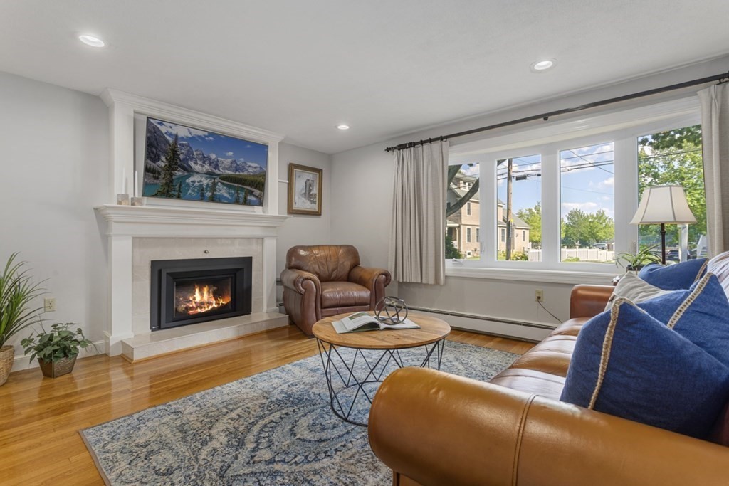 25 Oak Street Reading, MA 01867 - Photo 6 of 42 a living room with furniture and a fireplace