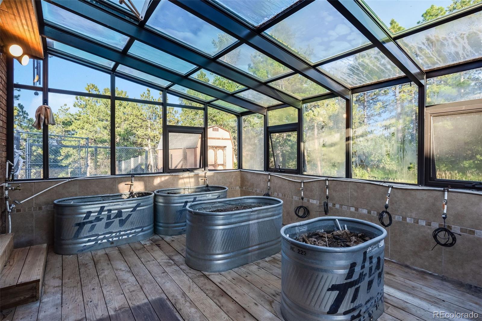 7572 Surrey Drive Morrison, CO 80465 - Photo 28 of 38 a room with furniture and large windows