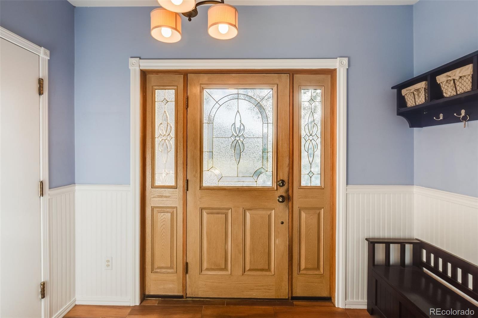 7572 Surrey Drive Morrison, CO 80465 - Photo 6 of 38 a view of front door