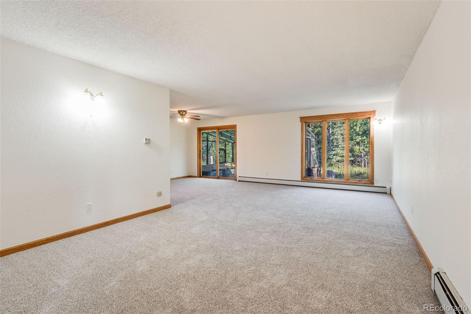 7572 Surrey Drive Morrison, CO 80465 - Photo 7 of 38 an empty room with windows