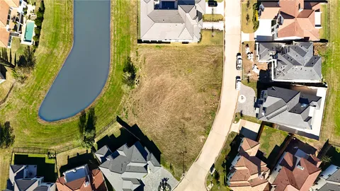 an aerial view of a house with a swimming pool
