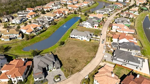 an aerial view of a residential apartment building with a yard