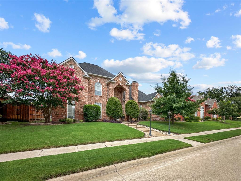 3405 Snidow Drive Plano, TX 75025 - Photo 3 of 24 Traditional home with a front yard, brick siding, and a shingled roof