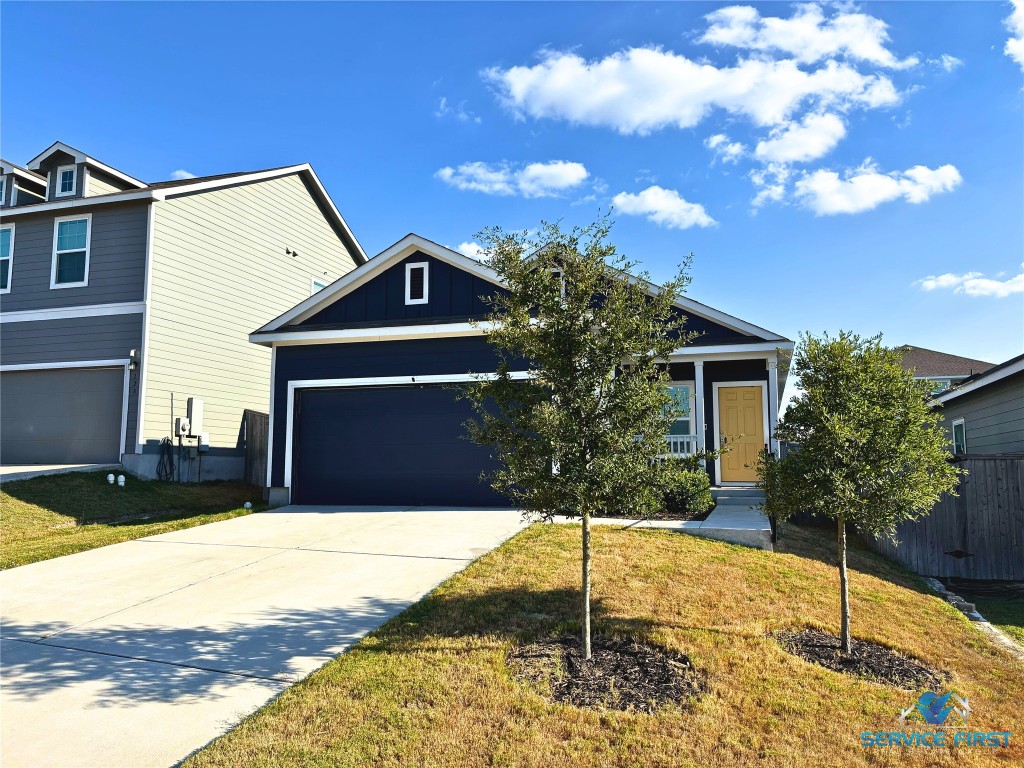 124 Rooster Way Jarrell, TX 76537 - Photo 1 of 27 a front view of a house with a yard