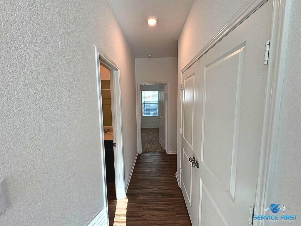 124 Rooster Way Jarrell, TX 76537 - Photo 16 of 27 a view of a hallway with wooden floor
