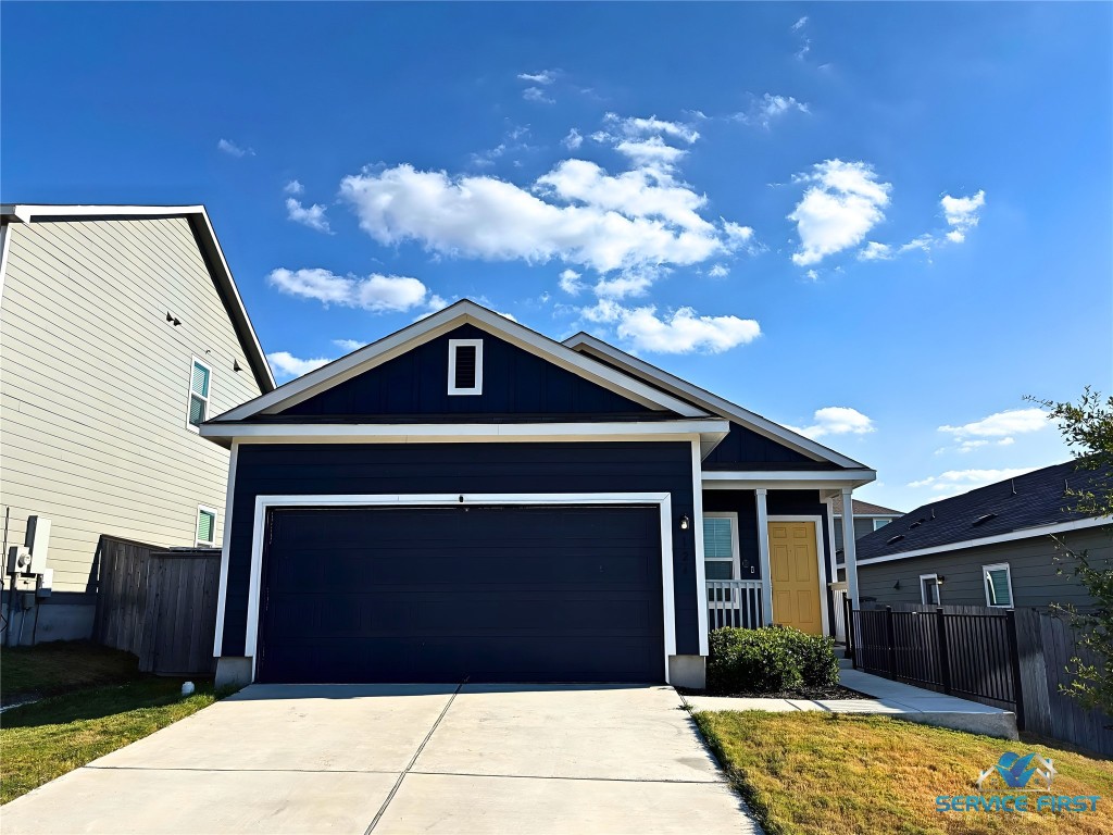 124 Rooster Way Jarrell, TX 76537 - Photo 2 of 27 a front view of a house with a yard