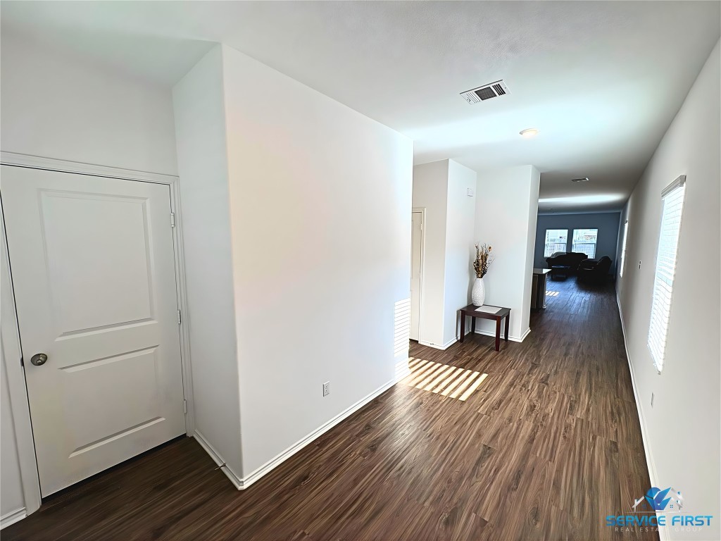 124 Rooster Way Jarrell, TX 76537 - Photo 3 of 27 a view of livingroom with hardwood floor and hallway