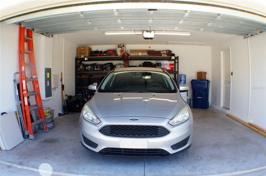1714 Lanier Road Zephyrhills, FL 33541 - Photo 22 of 23 a car parked in a garage