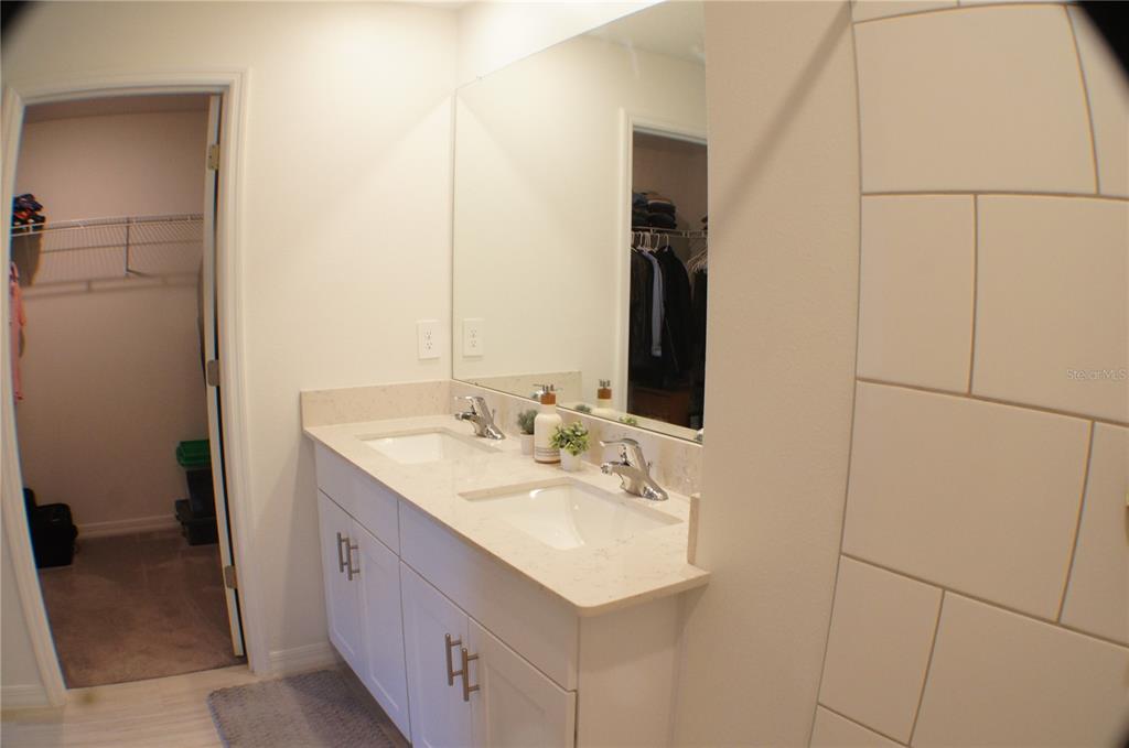 1714 Lanier Road Zephyrhills, FL 33541 - Photo 8 of 23 a bathroom with a sink and a mirror