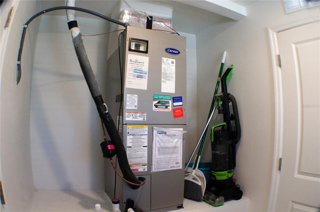 1714 Lanier Road Zephyrhills, FL 33541 - Photo 9 of 23 a view of walk in closet with clothes and shoes