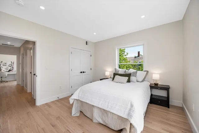 a bedroom with a bed and a table