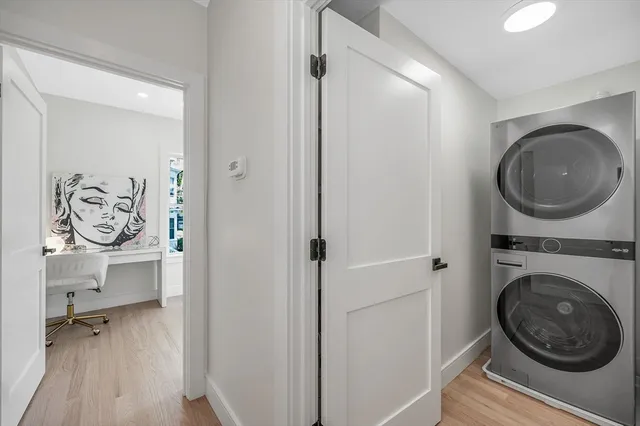 a view of a hallway with washer and dryer