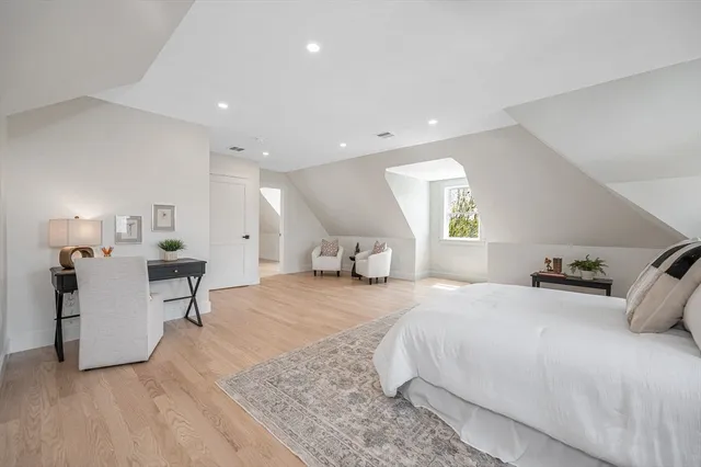 a bedroom with a bed and a cabinets