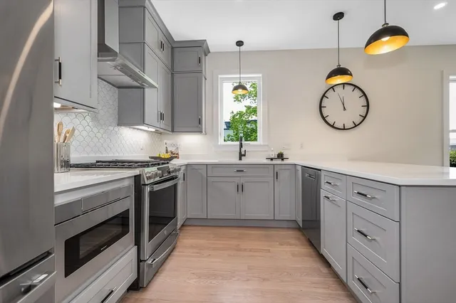a kitchen with cabinets and window