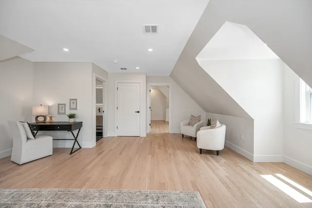 a view of kitchen with furniture and wooden floor
