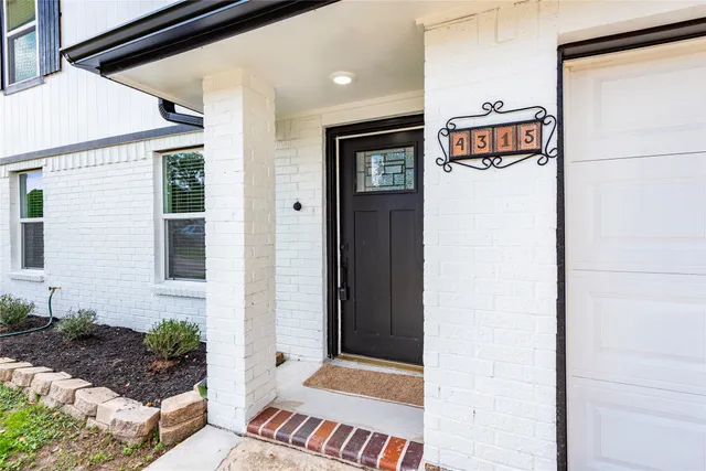 a front view of a house with garage