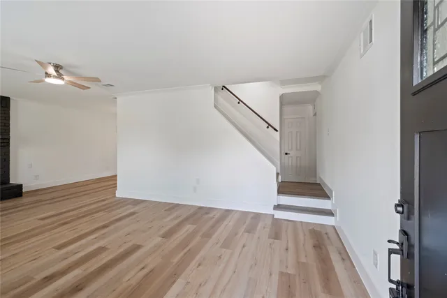 a view of entryway with wooden floor