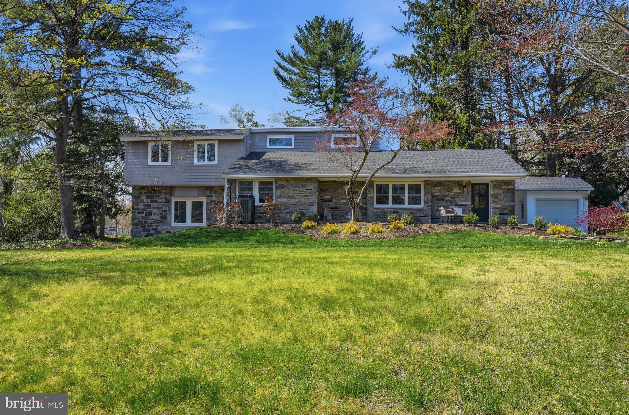 409 South Providence Road Wallingford, PA 19086 - Photo 7 of 106 Charming home with lush greenery.