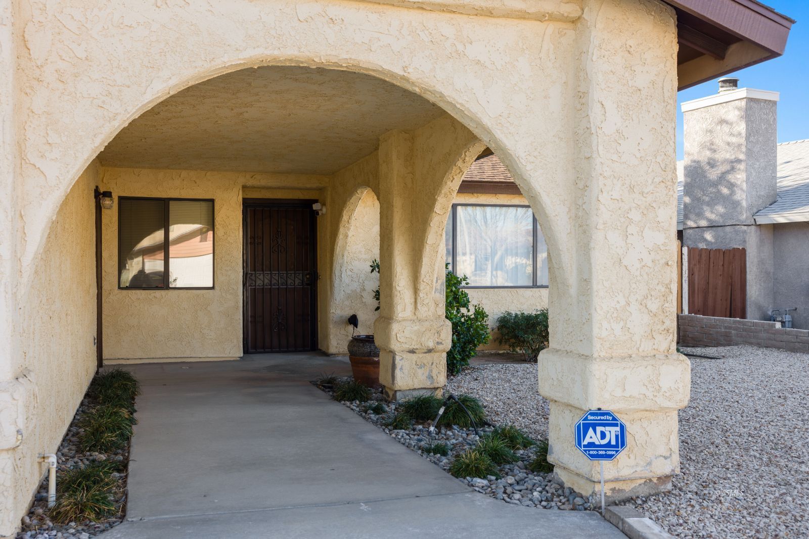 135 Chambers Street Ridgecrest, CA 93555 - Photo 4 of 26 a front view of a house with sign board